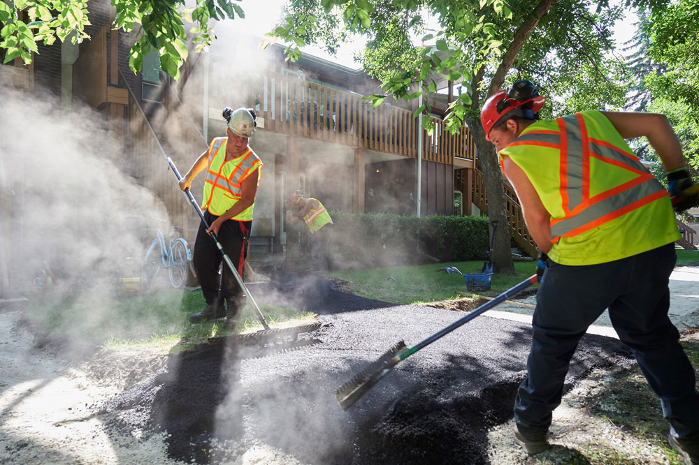 The Superior Asphalt team builds a new residential walkway in Winnipeg