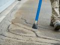 Driveway cracks are inspected prior to sealing them