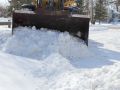 Superior Asphalt uses equipment with large buckets to clear snow more efficiently